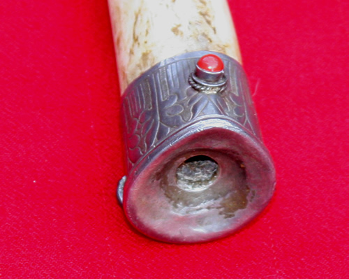 The silver mouthpiece of one of Ngakchang Rinpoches kanglings